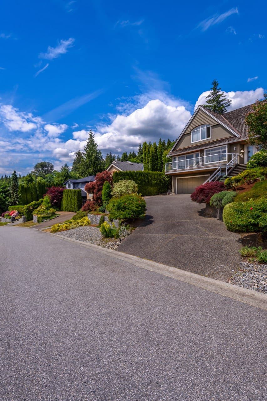 New asphalt driveway at a suburban home